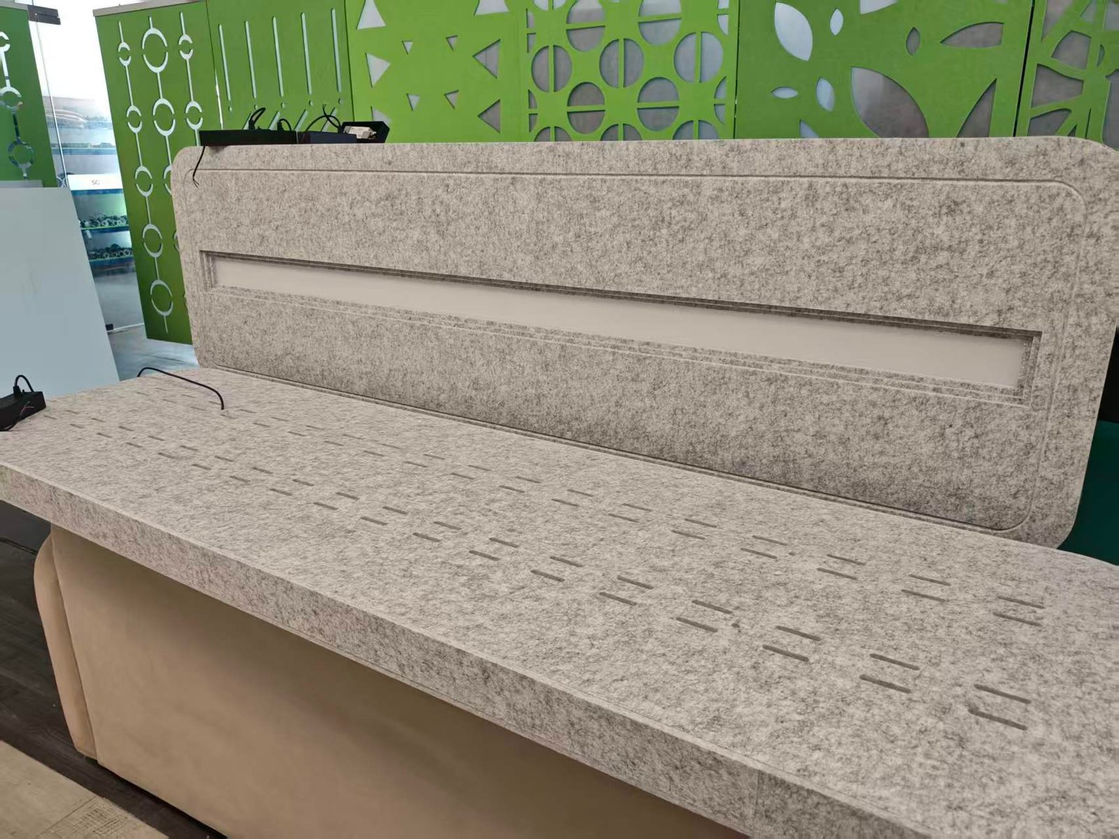 Grey PET felt panels with recessed linear light channels
